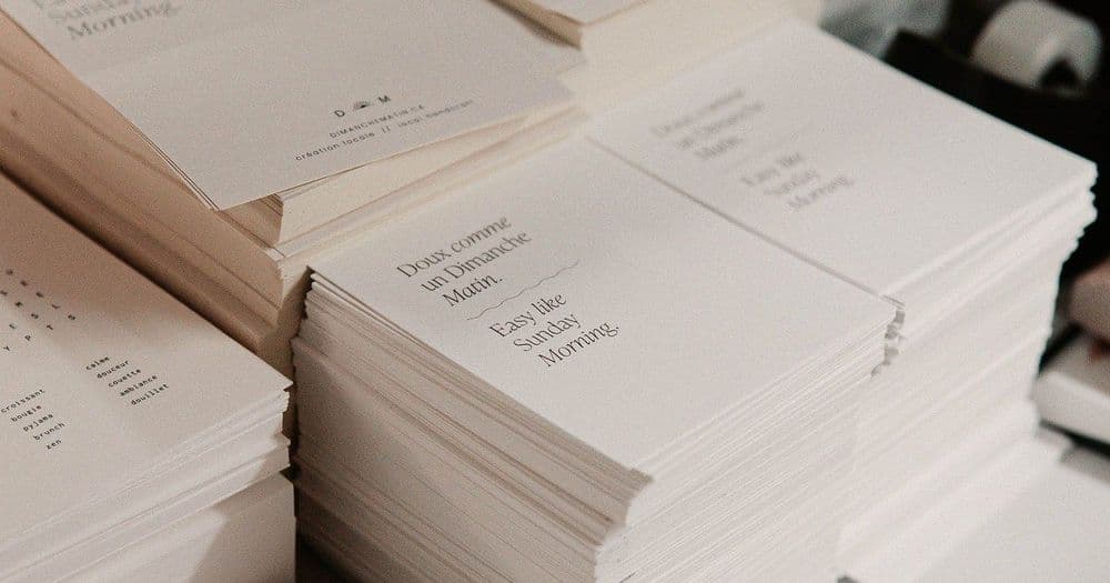 Stacks of printed cards and paper ready for bulk orders